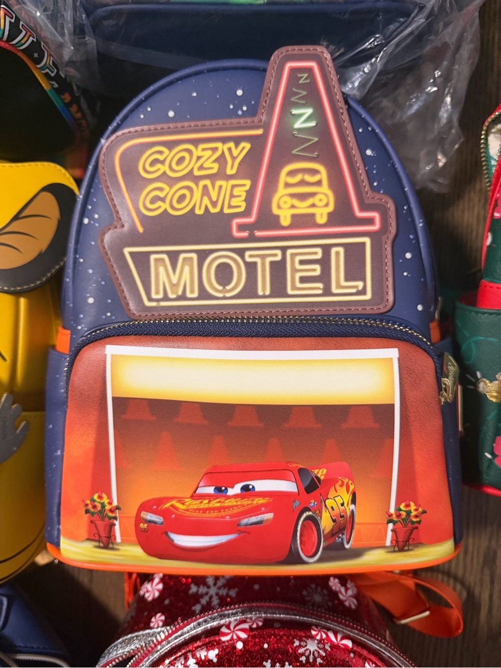 Loungefly Disney Pixar Cars Cozy Cone Motel Lightning McQueen Mini Backpack